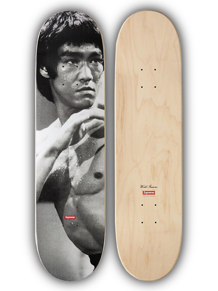A skateboard deck shown from both sides: one side features a black-and-white graphic print of Bruce Lee, and the other side shows a natural light wood grain finish with grip dots and a small red Supreme logo near the tail.